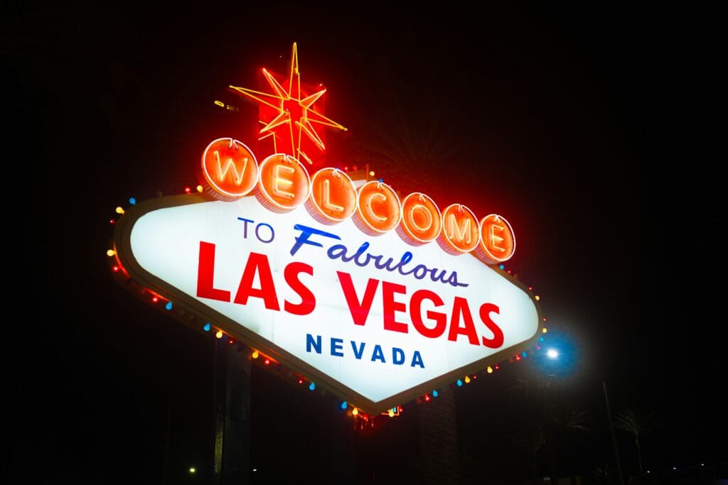 The iconic 'Welcome to Fabulous Las Vegas' neon sign illuminated at night, symbolizing DelRecruiters' premier staffing solutions serving Las Vegas's thriving supply chain and logistics industries
