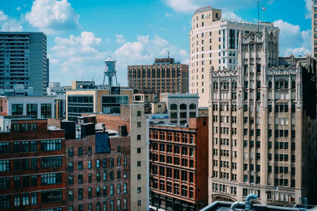 Daytime skyline of downtown Detroit featuring historic brick buildings and modern offices—representing the city’s blend of manufacturing legacy and modern supply chain leadership