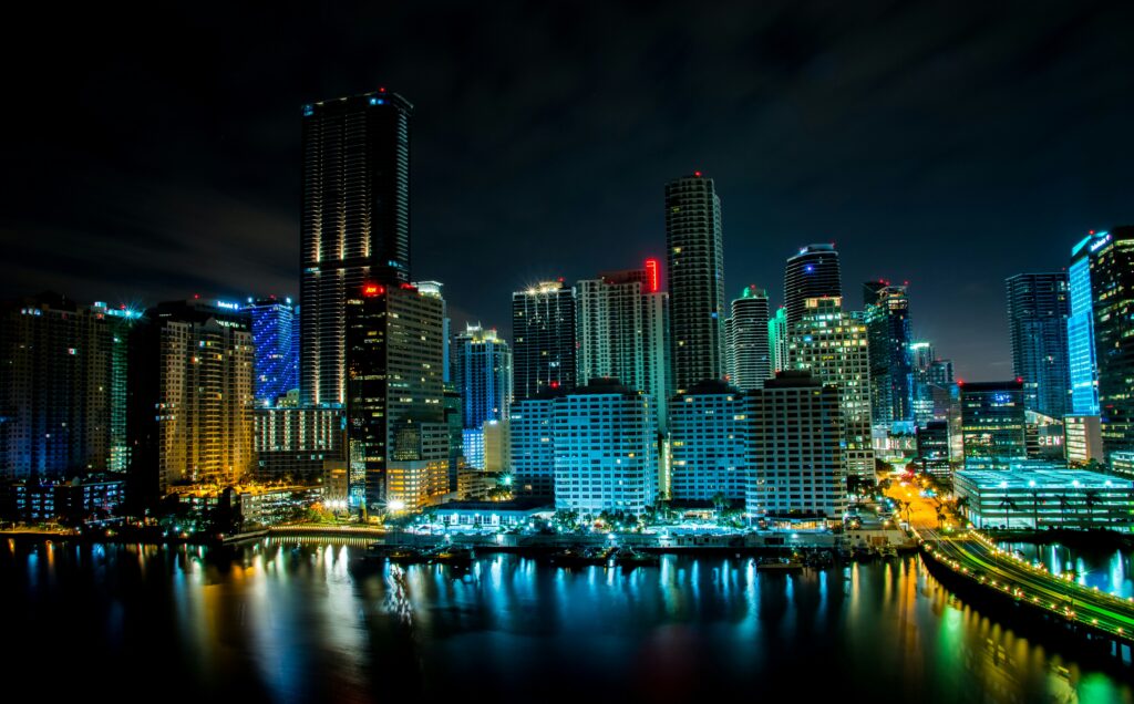 Miami logistics recruiters — Port of Miami cargo containers, freight trucks, and Miami skyline representing supply chain, import export, and e-commerce recruiters
